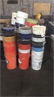 large assortment of fine gallon buckets