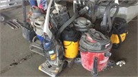 assortment of shop vacs and sweepers