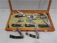 Display case of (11) folding knives by Camillus