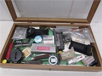 Display case full of assorted sporting goods –