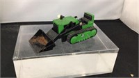Green metal Tonka bulldozer with scoop