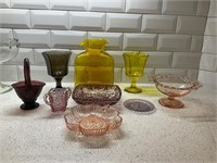 A Collection of Various Colored Glassware Items