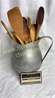 Wooden spoons in aluminum pitcher
