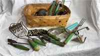 Green wooden handle utensils in garden basket