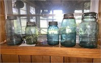 Shelf with blue fruit jars