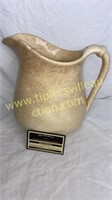 Old ironstone pitcher has been repaired