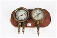 PAIR OF MOUNTED BRASS GAUGES ON WOODEN BASE