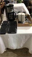 Coffee pot, keyboard, speakers, computer