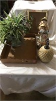 Figurines, fake plant, picture frame