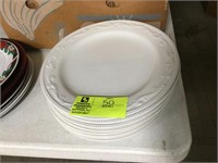 group of white glass decorative plates
