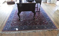Wool Pile floral area rug with extensive damage