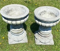 TWO VINTAGE CAST STONE URNS ON BASES