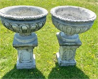 TWO LARGE VINTAGE CAST STONE URNS ON BASES