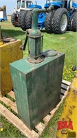 Vintage oil tank with hand pump