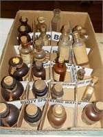 quantity of small advertising bottles