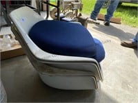 4 fiberglass boat seats with cushions.