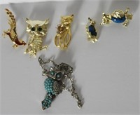 Jewelry flat of figural owl costume jewelry to