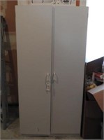 Two door white storage cabinet 35” x 21” x 72"