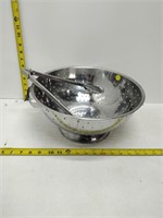 large stainless steel colander with tongs