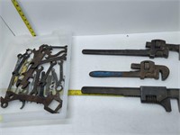 lot of hardware - pipe wrenches, wrenches, etc.