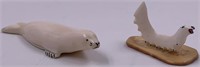 2 Alaskan Ivory carvings: one is a seal the other