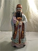 Chinese porcelain man with baby figure