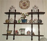 Wooden wall shelf with contents