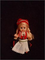 Small Plastic Doll with Blonde Hair and Red Cap