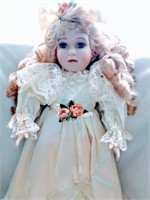 Blonde and Blue-eyed Ceramic Doll with White Dress