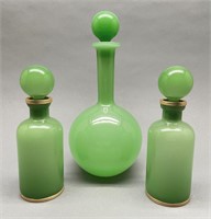 2 green Opaline bottles and 1 bulb decanter.
