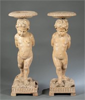 Pair of carved wood cherub stands.