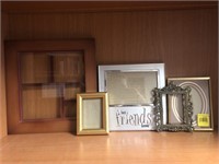5 unmatched picture frames