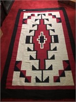 Black, white, and red patterned rug.