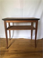 Cherry finished side table with black banding on