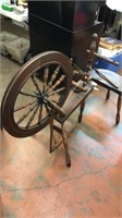 Small antique spinning wheel with stool