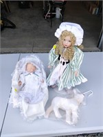 porcelain baby doll and other doll