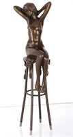BRONZE STATUE OF WOMAN ON STOOL WITH FLOWERS