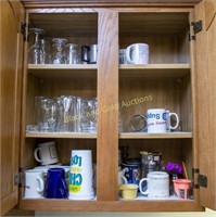 Kitchen cabinet full of mugs and glasses