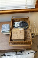 Basket with assorted stone coasters and trivets
