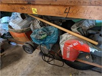 Contents of lower shelf on workbench