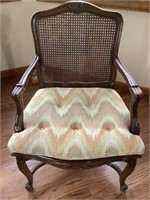 Wicker chair with cushion.   Has slight wear but