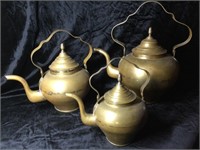 3 brass kettles