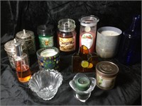 Assortment of candles and votive holders
