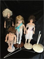 Porcelain dolls with stands. Clothing in the