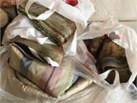 Three large bags of heavy tapestry material