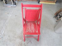 Red wooden fold up chair