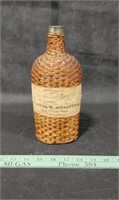 Early Woven Whiskey Bottle