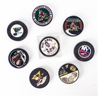 Lot of Eight NHL Souvenir & Official Hockey Pucks