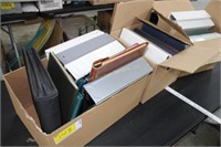 Three boxes of binders