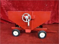 Vintage red steel ertl gravity wagon.